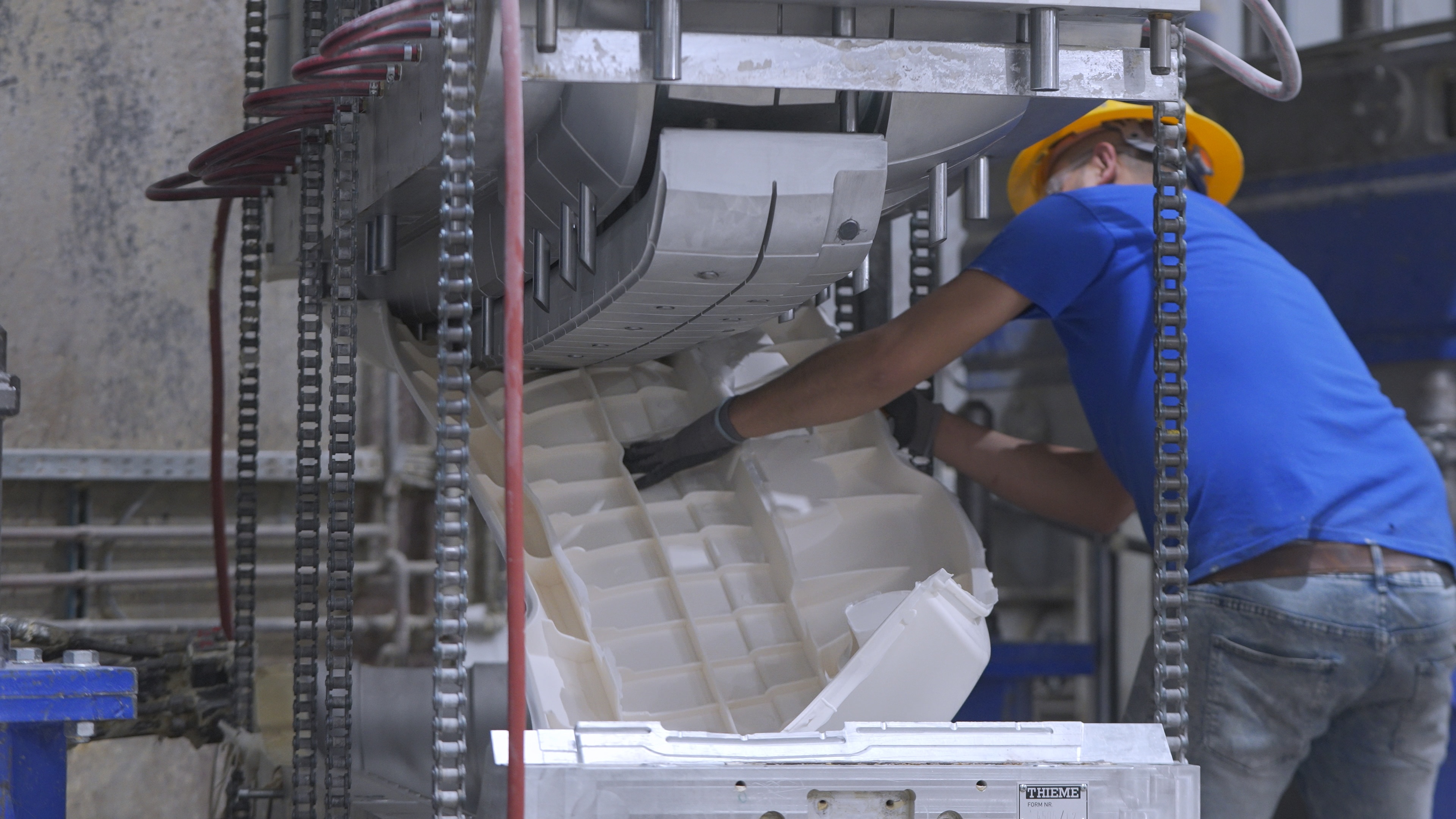 a finished part being removed from the RIM mold